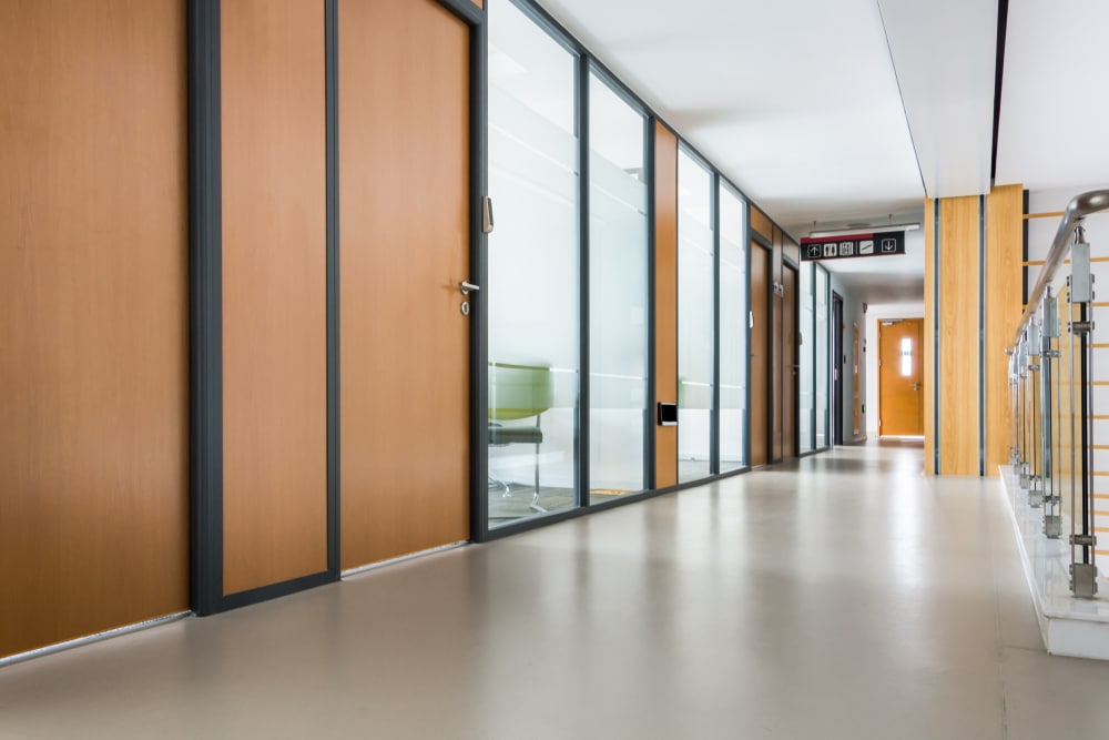 interior hallway of an office building with solid core interior doors