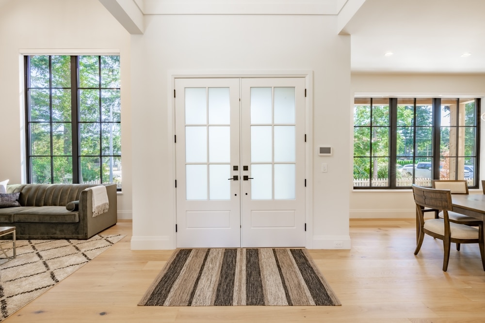 white steel door with dark hardware accessories